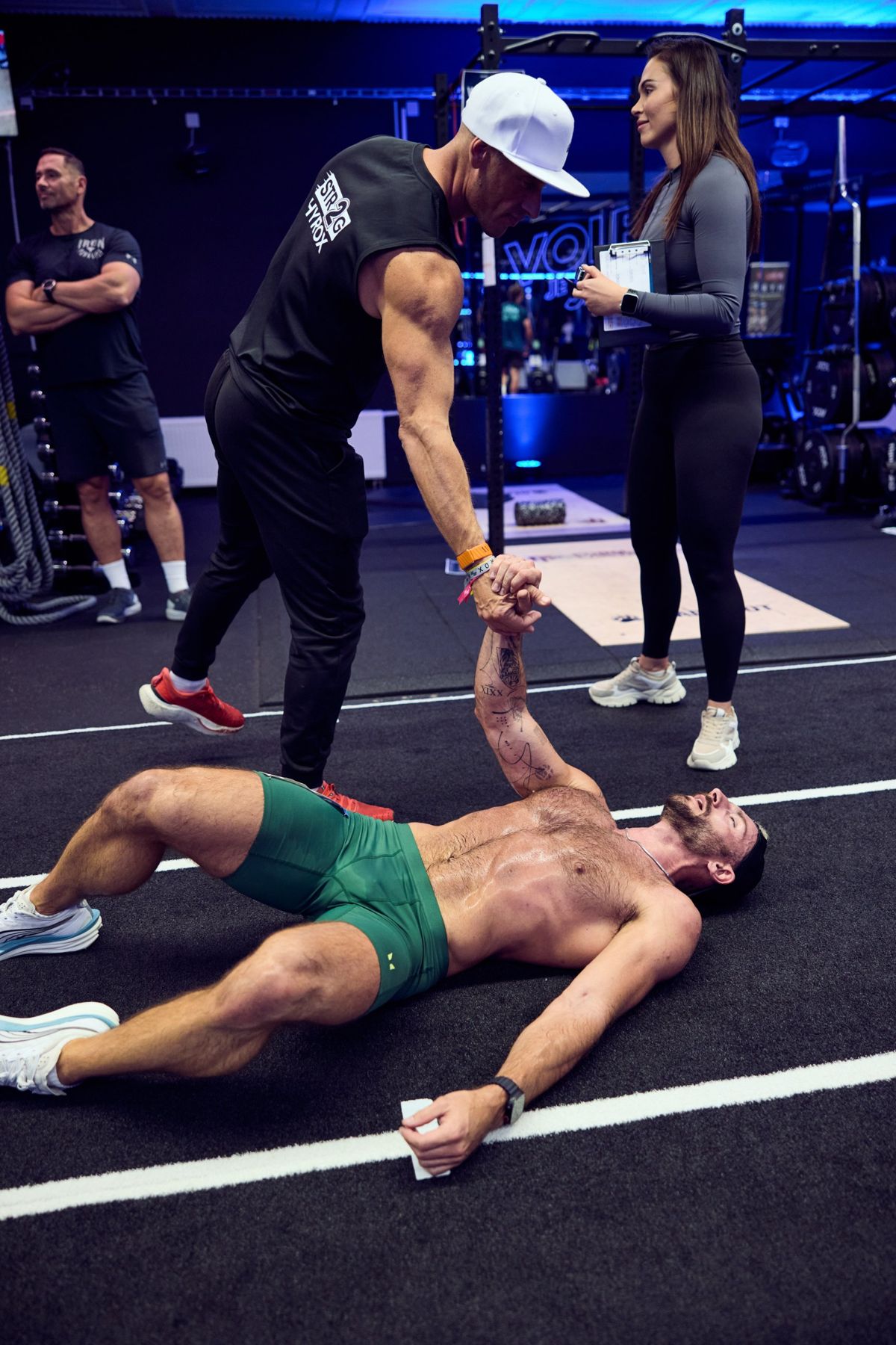 Láďa helping an athlete after a hard effort