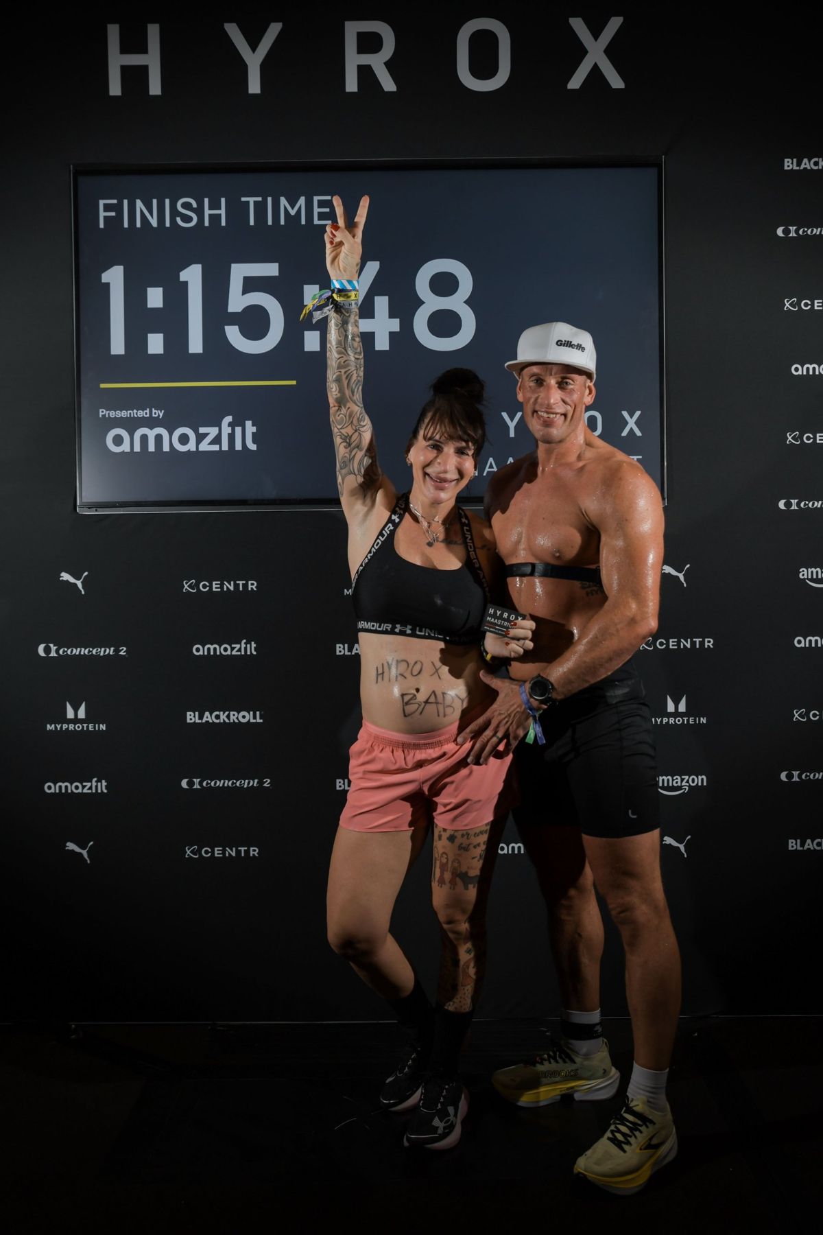 Láďa and Ria at the HYROX finish time board